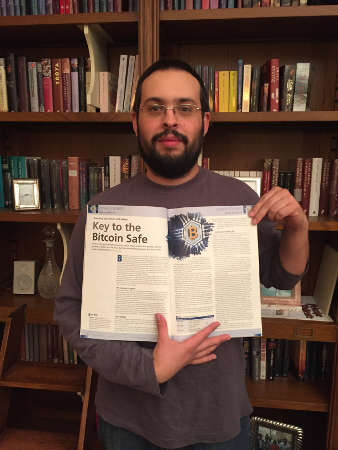 Rubén Llorente, holding a copy of the magazine