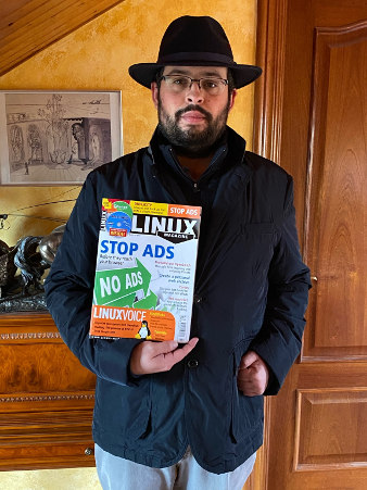 Rubén Llorente, holding a copy of the magazine